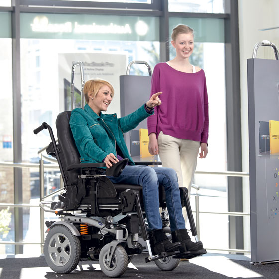 lady in a wheelchair pointing